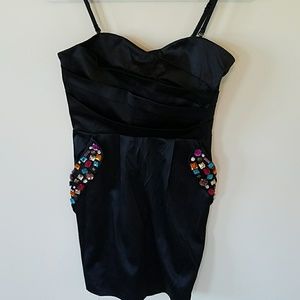 Strapless black dress w detailing on pockets